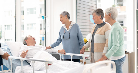 Image showing Hospital, prayer and women visit man for comfort, care and support for wellness, service and surgery. Healthcare, medical clinic and friends with patient for recovery, rehabilitation and praying