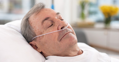 Image showing Oxygen, hospital bed and senior man sleeping with ventilation and breathing tube support in a clinic. Elderly patient, medical care and emergency room with male person at a doctor for healthcare