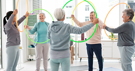 Image showing Fitness, senior and people with hula hoop at the gym for training, workout and health in retirement. Happy, together and a group of elderly friends with a coach and gear for an exercise class