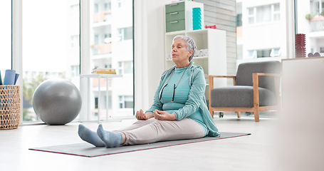 Image showing Yoga, meditation and senior woman with mindfulness and training peace, calm or home exercise for wellness. Health, spiritual and elderly person workout for zen mindset or breathing in an apartment
