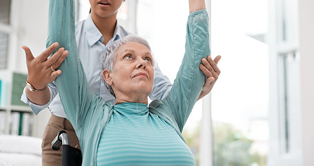 Image showing Woman with disability, physiotherapy and dumbbell exercise of healthcare rehabilitation, consulting or physical therapy assessment. Clinic, physiotherapist and support of senior patient in wheelchair