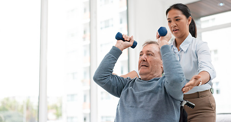 Image showing Man with disability, physiotherapy and dumbbell exercise for healthcare rehabilitation, consulting and physical therapy assessment. Clinic, physiotherapist and support of senior patient in wheelchair