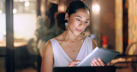 Image showing Night office, tablet and business woman typing email, report or sales proposal. Overtime, technology or black female employee with touchscreen busy working late on marketing project in dark workplace