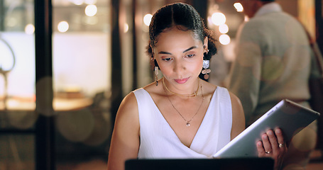 Image showing Night office, tablet and business woman typing email, report or sales proposal. Overtime, technology or black female employee with touchscreen busy working late on marketing project in dark workplace