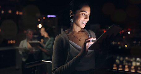 Image showing Woman, digital tablet and rooftop at night in city for social media, research and networking on urban background. Business woman, balcony and online search by entrepreneur working late in New York