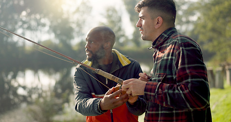 Image showing Fishing, lake and friends in nature talking on holiday, adventure and vacation together outdoors. Friendship, conversation and men with rods by river for sports hobby, activity and catching fish