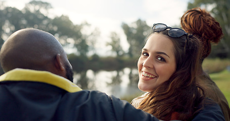 Image showing Happy, face and woman with friends on lake, camping in nature or group laughing and bonding on outdoor picnic at the park. Portrait, girl or smile in conversation, social gathering or relax in woods