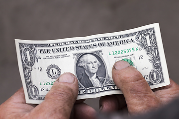 Image showing one American dollar old hands