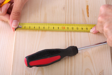 Image showing wooden plank and measuring tape 