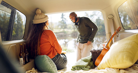 Image showing Winter and a couple in a car for a road trip, date or watching the view together. Happy, travel and back of a man and woman with an affection in transport during a holiday or camping in nature