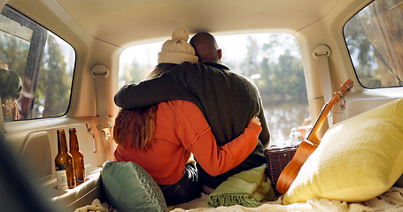 Image showing Hug, winter and a couple in a car for a road trip, date or watching the view together. Happy, travel and back of a man and woman with an affection in transport during a holiday or camping in nature