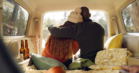 Image showing Road trip, nature and couple hug in car from back, relax on adventure together with love and freedom. Camping journey, black man and woman embrace in van, romantic travel holiday at lake in camper.