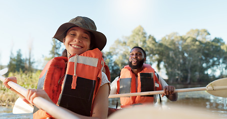 Image showing Couple, kayak and rowing on a lake in nature for sports challenge, adventure or travel with a smile. Young man and woman friends together on boat and water for fitness, travel and holiday for freedom