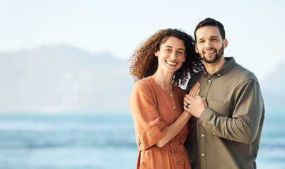 Image showing Couple, outdoor and portrait with love, marriage and happy from travel by the ocean. Smile, hug and gratitude from a woman and man together with care on vacation and relax on holiday in summer