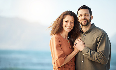 Image showing Couple, hug and happiness at the beach, love and care with bonding, travel and trust in a marriage. Life partner, mockup space and adventure in nature, people on holiday with respect and romance