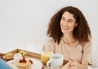 Image showing Breakfast, morning and woman in bed for birthday, anniversary celebration and romantic gesture. Relationship, love and happy couple with healthy food on tray for wellness, nutrition and surprise