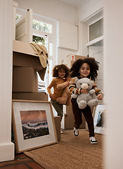 Image showing Girl, children and happy in new home, running and toys with game, moving and excited for new beginning. Kids, teddy bear and playful with games at door in apartment, family house and freedom in lobby