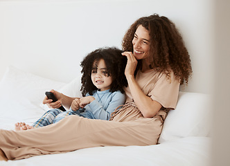 Image showing Bedroom, happy family child and mother watching tv series, movie or streaming online video, cinema or entertainment. Home bed, kids and relax woman, mom or mama watch cartoon show, television or film