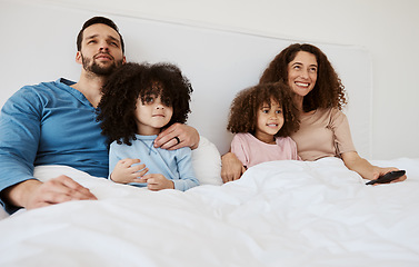 Image showing Bedroom, kids and parents watch television series, subscription movies or streaming morning video, media or entertainment. Home bed, relax family or happy mother, father and children watching tv show