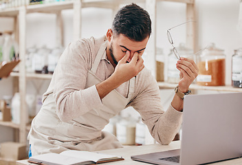 Image showing Store, laptop and man with a headache, stress and burnout with financial crisis, tired and overworked. Fatigue, entrepreneur and business owner with a pc, migraine and online shop management fail