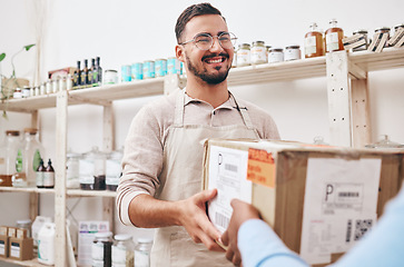 Image showing Man, small business and store with box delivery, smile and reception for supply chain, product and commerce. Young entrepreneur, cardboard package and happy for courier service in sustainable shop