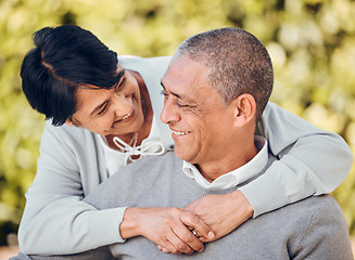 Image showing Love, smile and senior couple hug in a park with care, bond and enjoying relationship outdoor. Happy, romance and old people embrace in forest having fun with retirement, freedom or weekend in nature