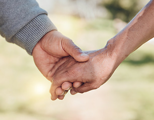 Image showing Holding hands, closeup and support, trust and love with people outdoor, solidarity and care while in nature. Healthy relationship, bond and wellness, commitment and comfort with peace and partner