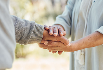 Image showing Senior couple, holding hands and love with support in outdoor, nature or bonding in backyard with care, comfort or kindness. Helping, hand and people in retirement together with empathy and trust