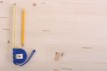 Image showing wooden plank and measuring tape 