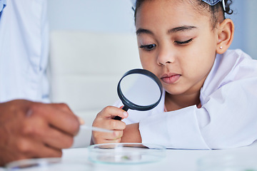 Image showing Child, science and girl with a magnifying glass in laboratory learning, research or curious to study chemistry in education. Kid, scientist and check with a magnifier on experiment, test or analysis