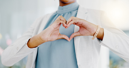 Image showing Hands, heart and business woman with love emoji for care, kindness and symbol in office. Closeup of happy female worker with finger shape for thank you, trust and sign of hope, support icon and peace
