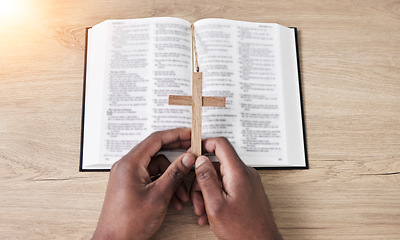 Image showing Bible, reading and cross with hands with book and religion study at home for worship and spiritual support. Faith, christian knowledge and person with gratitude, scripture education or above guidance