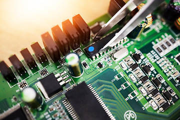 Image showing Motherboard, microchip tweezer and engineering closeup with electric maintenance of circuit board. Developer, IT and dashboard for electrical hardware and technician tools for information technology