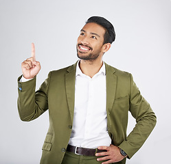 Image showing Businessman, thinking and man pointing for promotion, deal and logo isolated in a studio white background with smile. Choice, corporate and happy person or employee showing advertising or news