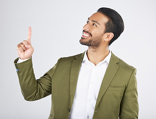 Image showing Businessman, thinking and happy man pointing for promotion, deal and logo isolated in studio white background. Choice, corporate and person or employee showing advertising or news with smile