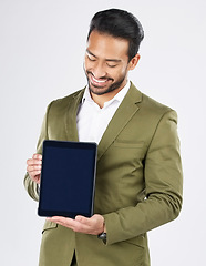 Image showing Happy asian man, tablet mockup and screen in advertising against a white studio background. Businessman smile with technology display or app in marketing, advertisement or branding on mock up space