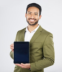 Image showing Happy asian man, portrait and tablet on mockup in advertising against a white studio background. Businessman with technology display or screen in marketing, advertisement or branding on mock up space