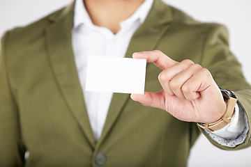 Image showing Man, hand and business card in advertising, marketing or branding against a white studio background. Closeup of businessman with paper, poster or sign for contact information or services on mockup