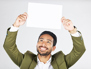 Image showing Happy asian man, billboard and sign for advertising, marketing or branding against a white studio background. Businessman smile with paper, poster or idea for message or advertisement on mockup space