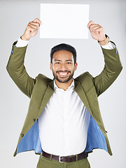 Image showing Happy asian man, portrait and billboard in advertising, marketing or branding against a white studio background. Businessman smile with paper, poster or sign for message or advertisement on mockup