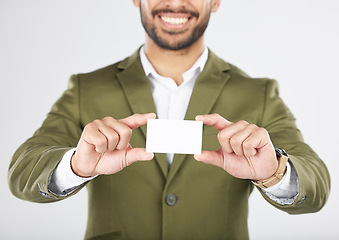 Image showing Happy man, hands and business card in advertising, marketing or branding against a white studio background. Closeup of businessman with paper or poster for contact information or services on mockup