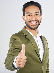 Image showing Happy asian man, portrait and thumbs up in winning, success or thank you against a white studio background. Businessman smile with like emoji, yes sign or OK in agreement, good job or approval