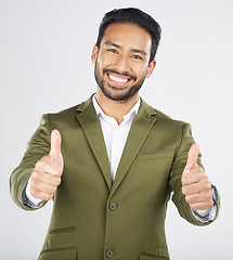 Image showing Happy asian man, portrait and thumbs up in thank you, winning or success against a white studio background. Businessman smile with like emoji, yes sign or OK in agreement, good job or approval