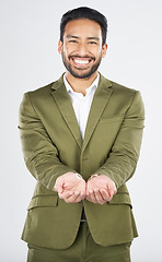 Image showing Hands, open and portrait of business man in studio for charity, begging for support and help. Happy, corporate and person with gesture for donation, financial aid and investment on white background