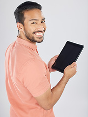 Image showing Smile, tablet and portrait of man search internet with technology isolated in a studio white background. Online, planning and young person or student working on connection or networking on app