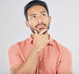 Image showing Thinking, face and asian man in studio for planning, choice or questions on grey background space. Idea, why and Japanese male model confused by decision, brainstorming or problem solving doubt emoji