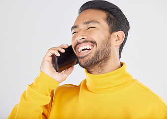 Image showing Phone call, happy and man laugh in studio for funny conversation, chatting and communication. Networking, mockup and isolated person on smartphone talking, speaking and share joke on white background