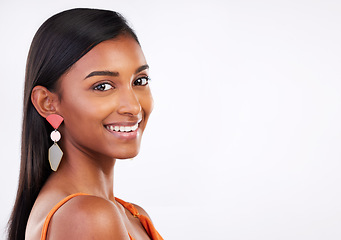 Image showing Portrait, beauty and happy woman in studio for makeup, glamour and natural cosmetics on white background. Smile, glowing skin and Indian female model face, shine and pose with body care satisfaction