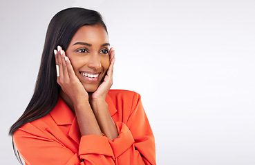 Image showing Smile, excited and hands on woman face in studio shy for news, promo or announcement on white background. Happy, emoji and Indian female model with gossip, gesture or cute reaction while isolated