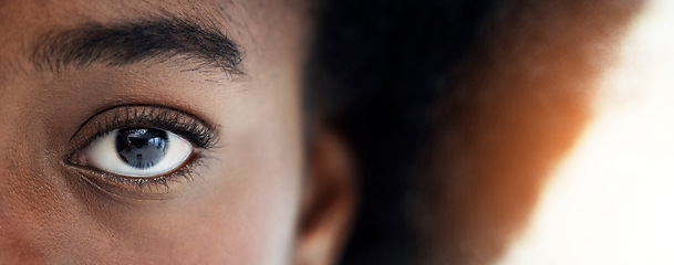 Image showing Eyes, closeup and portrait of African woman with mockup space for focus, thinking and vision. Banner, lens flare and zoom of half face of person looking for perception, awareness and intense stare